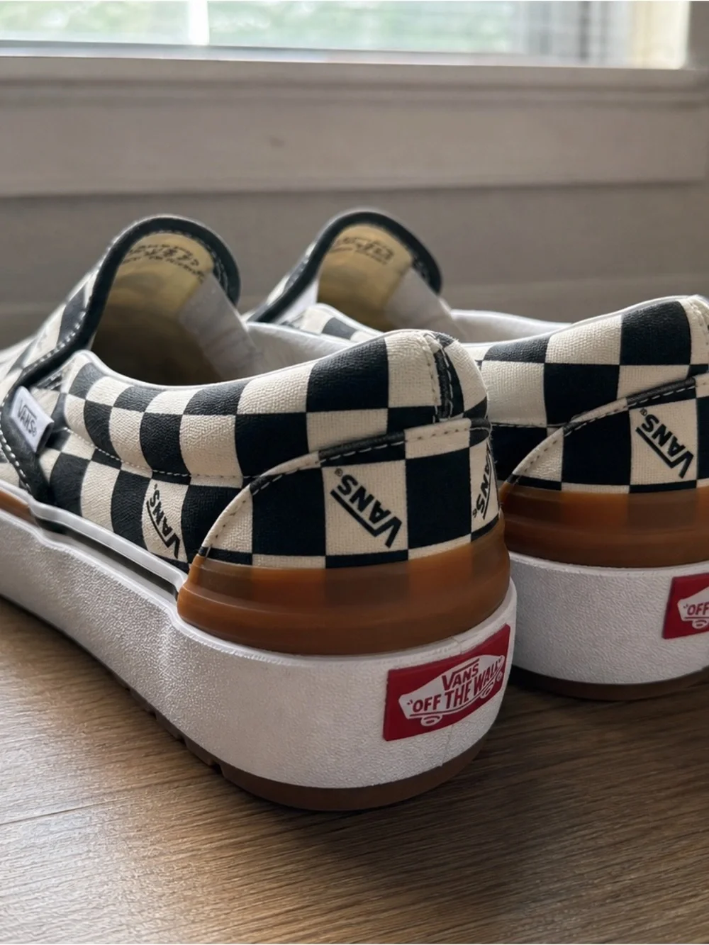 Vans Checkerboard Slip-On Sneakers in Black and White